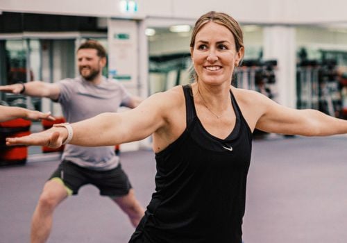 people doing yoga for group fitness