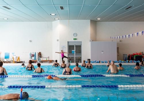 aqua group fitness class with instructor